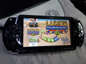 PSP SONY P1000 MODEL.BLACK COLOR 4GB SD CARD WITH 25 GAMES