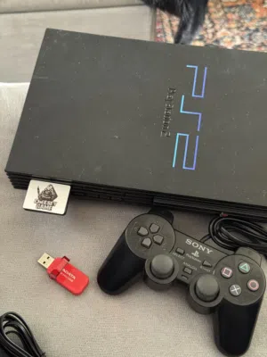 بلاستيشن 2 فات معدل فلاشة بيقرا سيديات ps2 fat