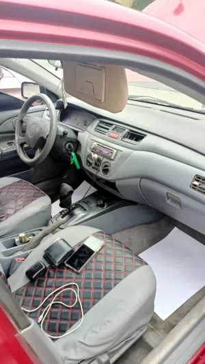 Used 2003 Mitsubishi Lancer Sedan with Repainted Exterior and Modern Features