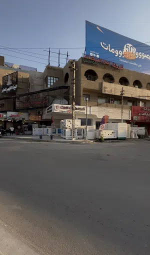 بناية تجاريه ركن للبيع موقع كراده