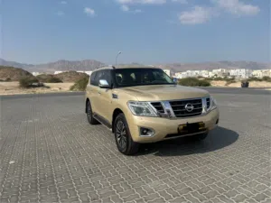 نيسان باترول 2014 خليجي ذهبي مستعمل بحالة ممتازة مع ميزات أمان وتقنيات حديثة