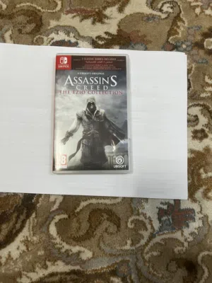 نينتندو سويتش مع يد Pro Controller أصلية ولعبة Assassin's