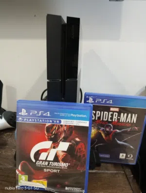 PS4 1TB with 2 controllers and 2 games and charging and fan dock