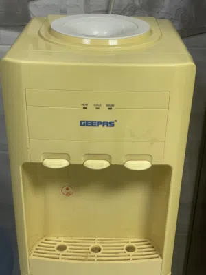 Water dispenser with freezer and hot and cold water feature