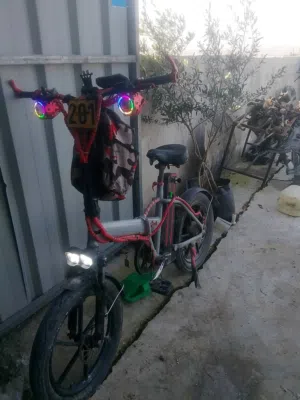 بسكليت كهربا عجل وسط     بطارية 48V /16A  ماتور350W/كمبيوتر500W  بريكات زيت  جنطات مغنيسيوم