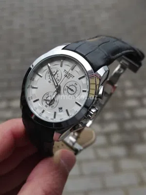 ساعة Tissot جديدة تيسو رجالية كرونوغراف كبا هو موضح في الصورة لون الجلد أسود