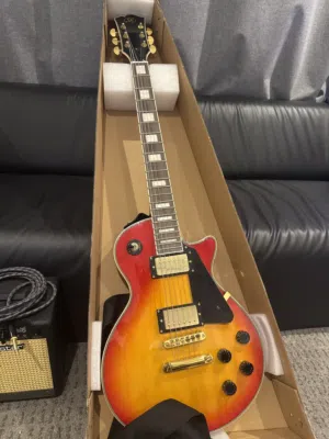 SX electric guitar with ampcable and strap