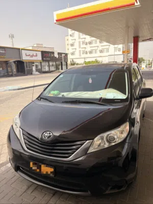 2014 Toyota Sienna Limited Black Gasoline Sedan with Electric Mirrors and Modern Interior Features