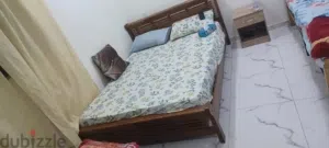 queen size bed with mattress  and side table