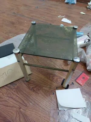 side table with glass top in good condition