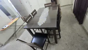 Dining table with 6 leather seated chairs.