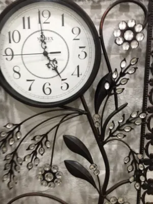 ساعه حائط معدنيه لون بني محروق