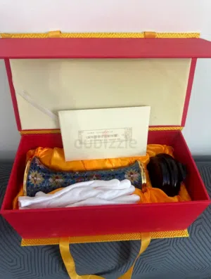 I'm selling a Chinese vase from the right (the one with the white handle).