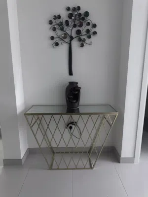 Glass console with golden design