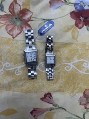 Brand new swisscardin male and female silver watch