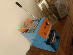 جهاز لتغليف الاكواب من الاعلى مع الرول