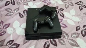 Sony Playstation 4  Good Condition  with 2 controllers and 2 cds power cable included