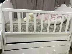 Baby crib with 2 new mattresses unused