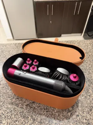 Dyson air wrap ( grey and pink ) used with care and regular cleaning perfect for daily styling