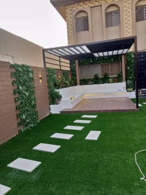 مظلات لكسان عشب جداري مع بديل الخشب ولاضاء نجيله ارضي وفرش صناعي