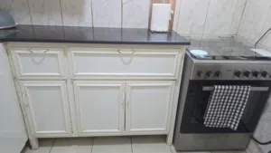 White cabinet with black marble in 25kd Pick up location Fahaheel No delivery