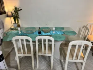 Glass top dinning table with eight chairs