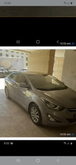 سيارة هيونداي النترا 2016 موديل رمادي بسقف داخلي بيج ونظام أندرويد أوتو