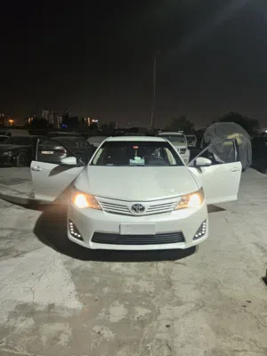Toyota Camry 2014 — GCC Specs — White on Beige The car everyone in Dubai trusts.