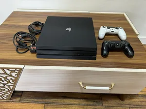 playstation 4 pro used but like new with 2 controllers