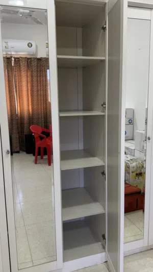 White wardrobe with mirror on doors