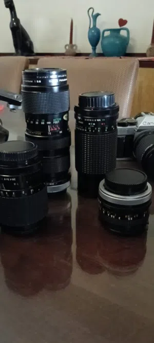 camera(Canon)with its lenses and tripod