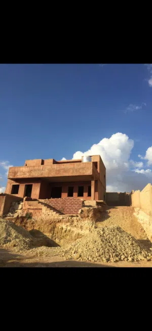 قطعة ارض مع فيلا من غير تشطيب في اجمل مناطق سيل حسبان بأطلالة على البحر الميت