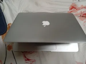 A renewed Apple MacBook Air 11" (Intel Core i5, 4GB RAM)  A used MacBook Air 13-inch (M1 chip, 8GB R