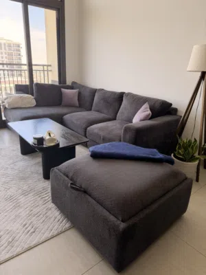 L-Shaped Sofa + Storage Ottoman + Coffee Table – AED 2,700