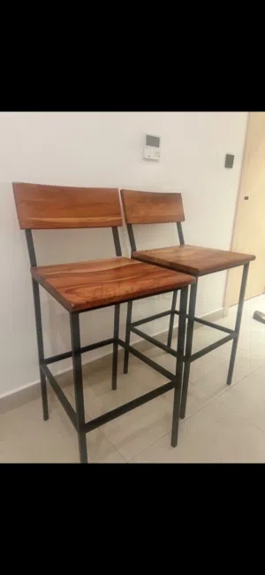 2 bar wood stool chairs. Bought them and never used them at all sticker still on them