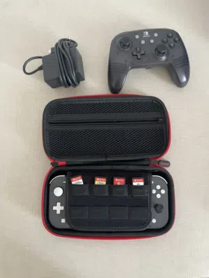 Nintendo switch lite for sale with 4 games, charger, case, and controller. dm for more info