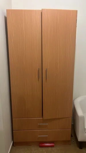 Single bed and cupboard