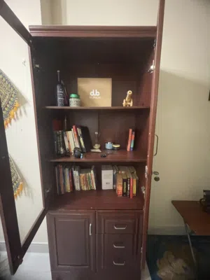 Book cabinet or Almirah with glass door, 2 top shelves, 3 bottom drawers and one bottom storage