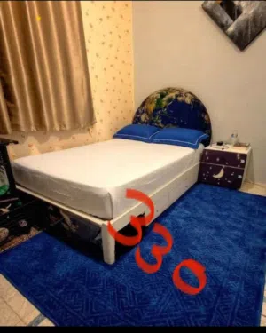 Bed with mattress and side table