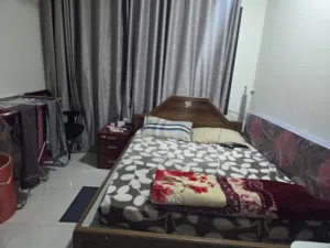 Bed with maters, cupboard, washing machine, small Fridge, TV with dish & setup box