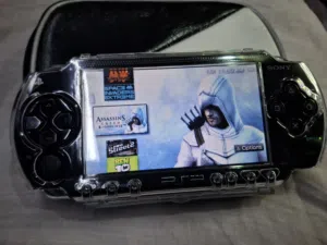 PSP P1003 MODEL.CLEAR CASE COVER BLACK COLOR 4GB SD CARD 35=GAMES AVAILABLE