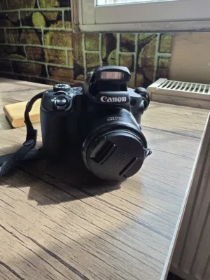 كاميرا كانون زووم بصري 65X بحالة الوكالة مع كامل ملحقاتها