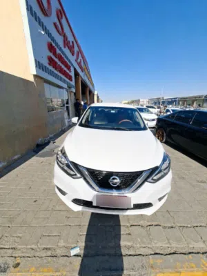 Nissan Sentra 2016, registered in Abu Dhabi with valid registration and insurance.