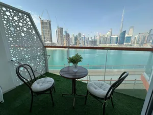 studio in business bay with burj khalifa and water canel