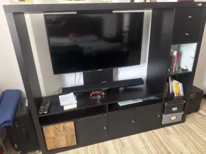 Samsung 46 inches TV Cabinet mounted TV along with the cabinet and Samsung Sound Bar (with Woofer)