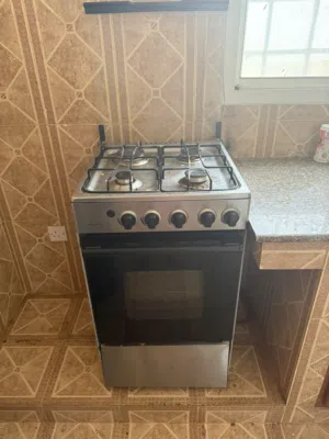 Refrigerator, cooking stove & cupboard