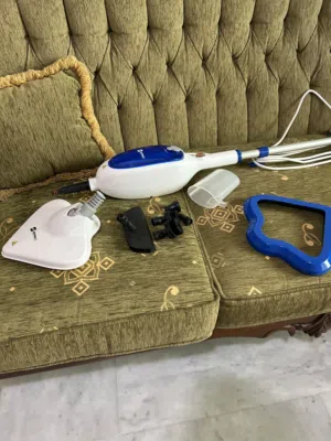 مكواة ملابس ومكنسة الكهربائية ماءً