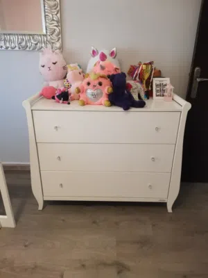 white three-drawer dresser with a classic, elegant design