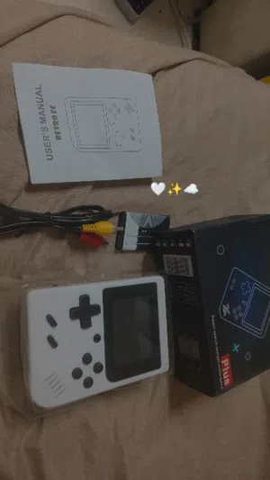 جهاز العاب رائع وجذاب صغير الحجم بقيمه 40 فقط ويحتوي على 400 لعبه