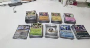 517 pokemon cards including ten EX cards and multiple normal shiny cards + a good condition binder